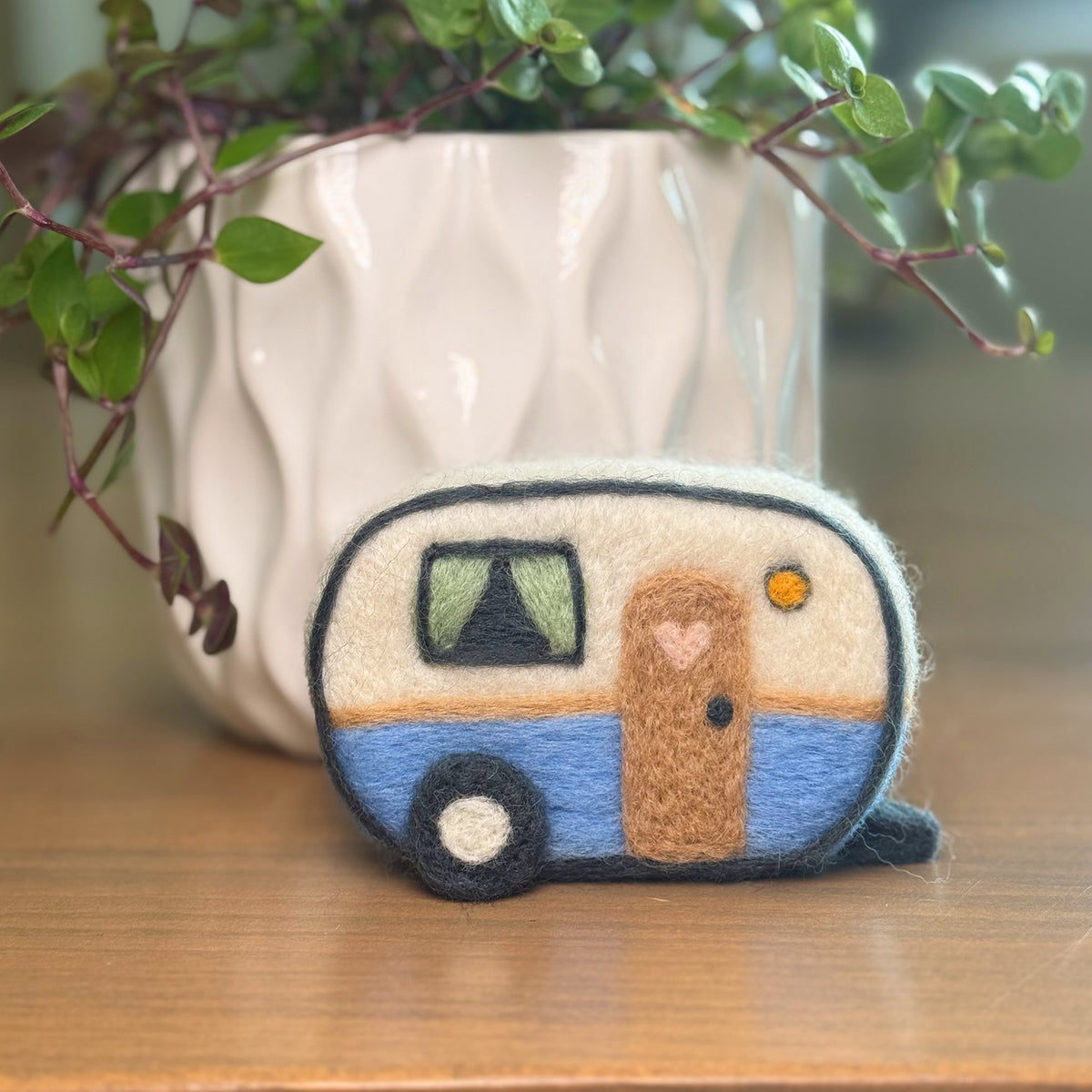 Handmade camper needle felting craft with plant in background, finished Feltie Kits DIY craft project