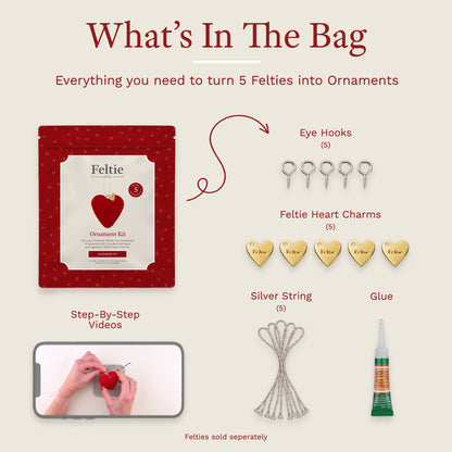 Feltie Kits ornament accessory kit contents including eye hooks, gold heart charms, silver hanging strings, glue and video instructions.