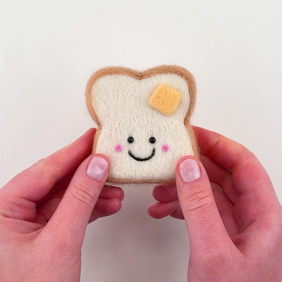 Step-by-step tutorial for the Feltie Kits Buttered Toastie needle felting kit, showing how to add crust to the toastie.