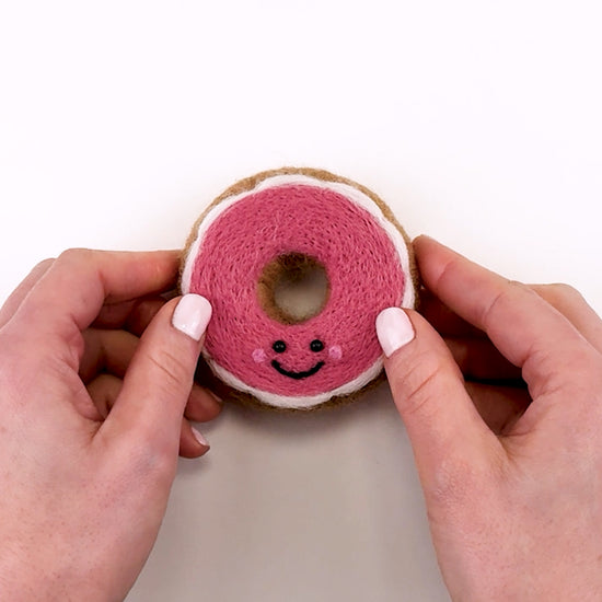 Introduction to the Feltie Kits Pink Glazed Donut needle felting project, showing the finished Feltie and an overview of what you’ll learn in the tutorial.
