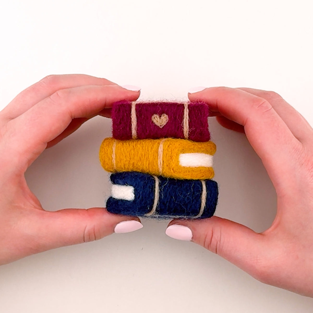 Introduction to the Feltie Kits Storybook Stack needle felting project, showing the finished Feltie and an overview of what you’ll learn in the tutorial.