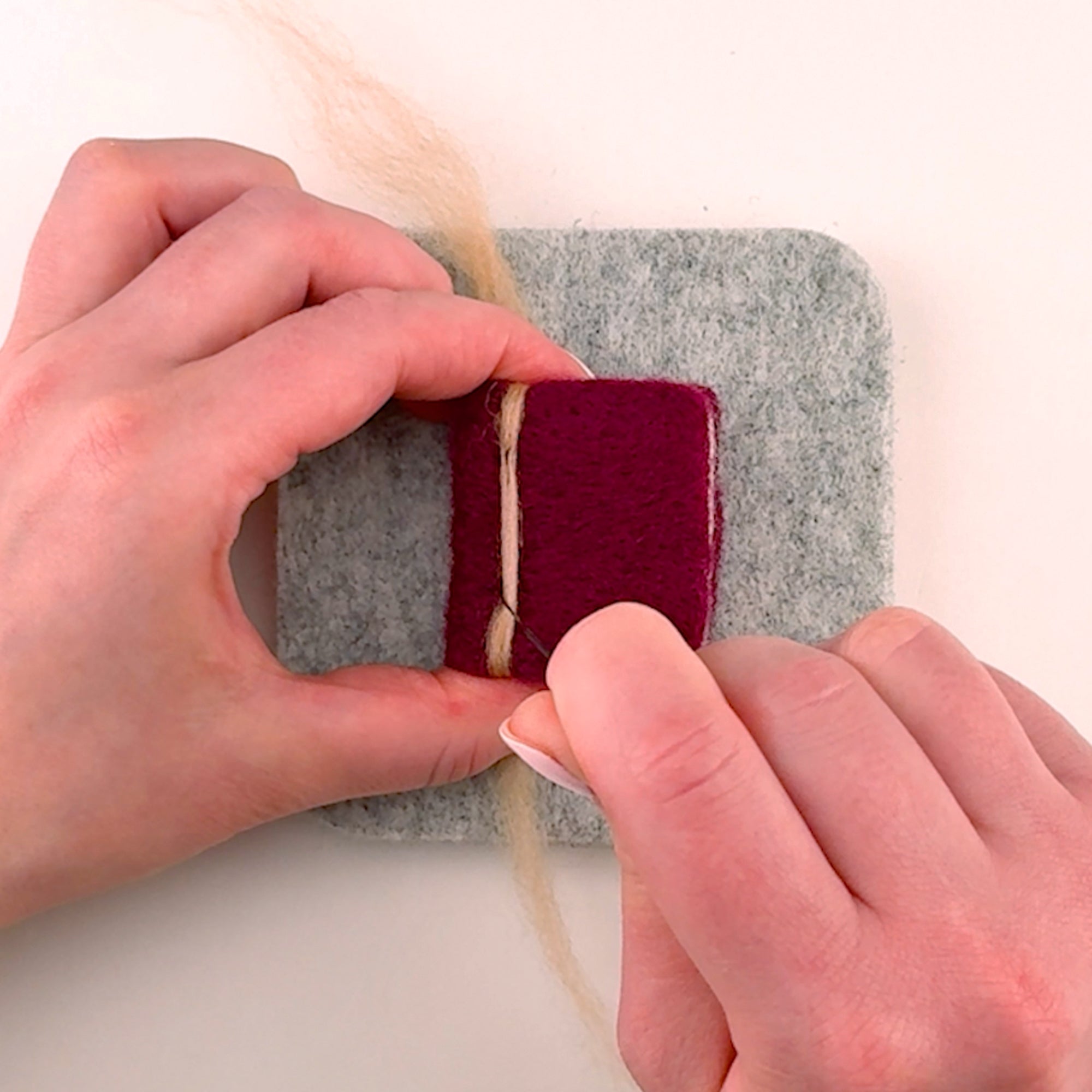 Step-by-step needle felting tutorial for The Storybook Stack from Feltie Kits, showing how to add the book spine accent.